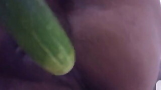 Wife plays with cucumber